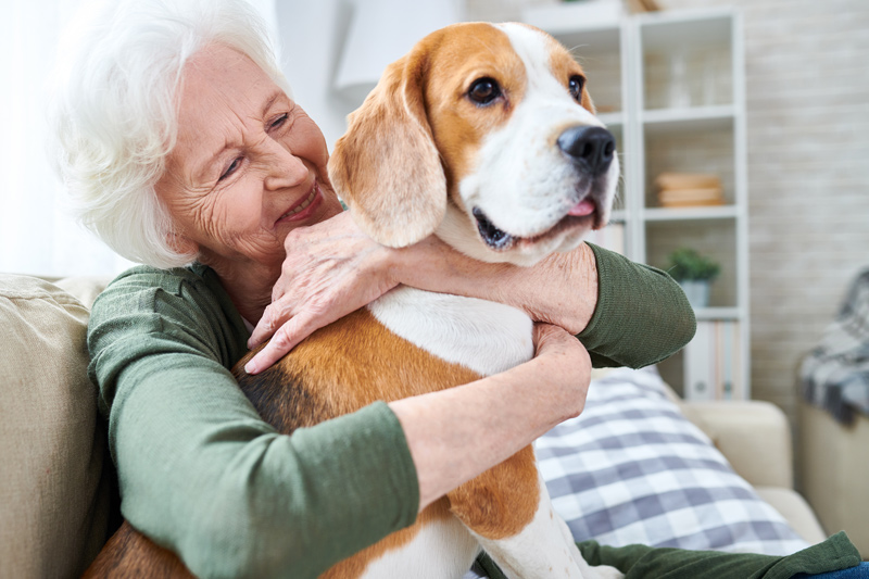 Senior with pet at retirement community in Medicine Hat