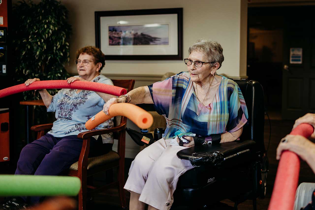 the wellington retirement residence happy seniors pool noodle fitness