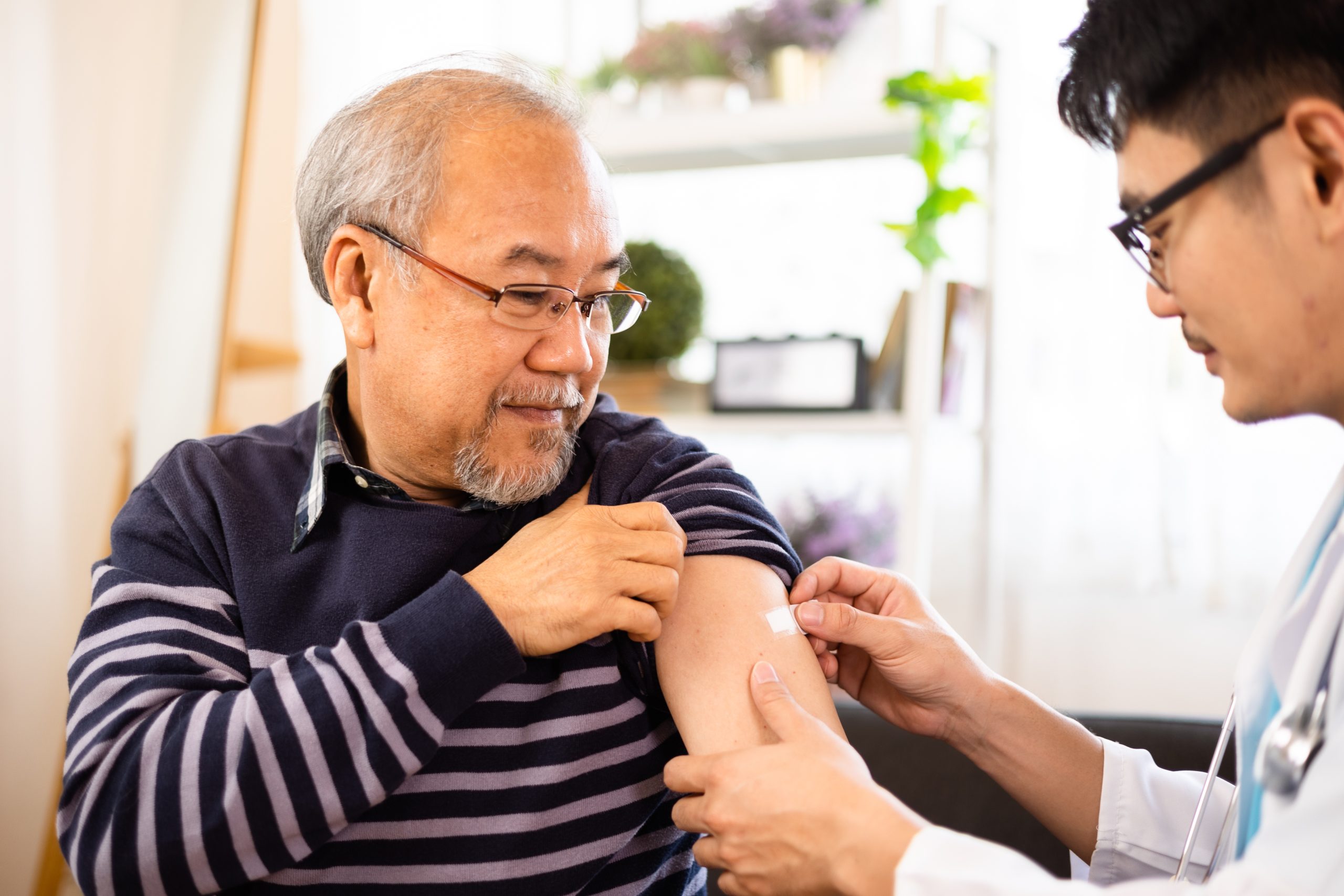 senior getting flu shot